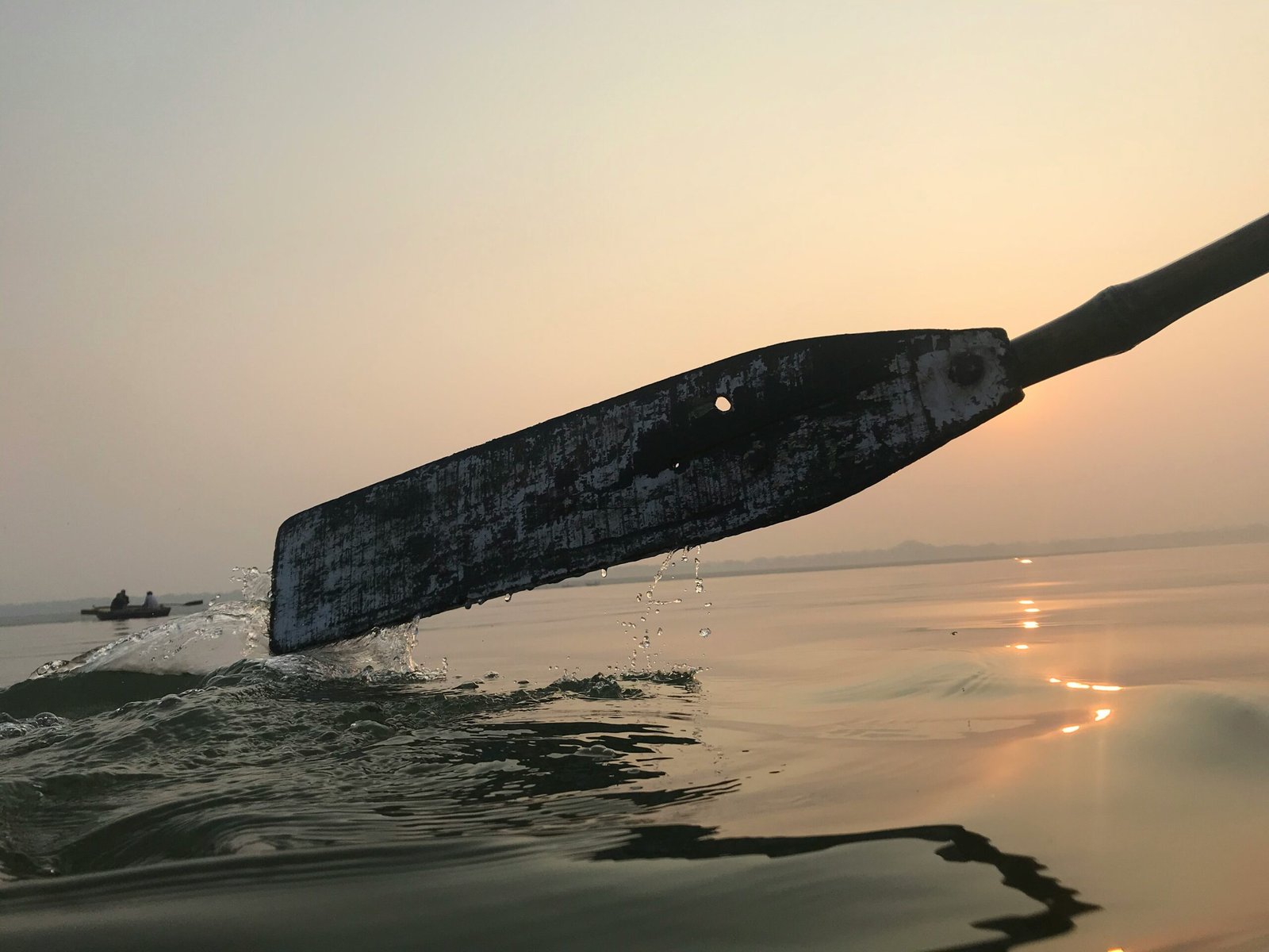 black wooden board on water during sunset